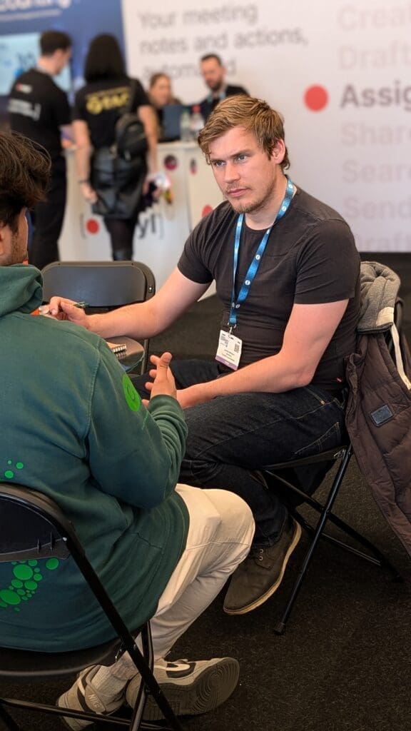 Visual Punch crew fitting a lapel microphone before filming